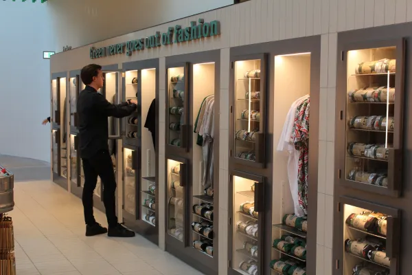 Interior view of the Heineken Experience merchandise store in Amsterdam, equipped with Mieloo & Alexander RFID inventory management and self-checkout systems.